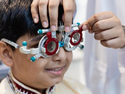 happy-indian-child-boy-examining-eyesight-modern-o-2025-03-06-02-32-38-utc-min